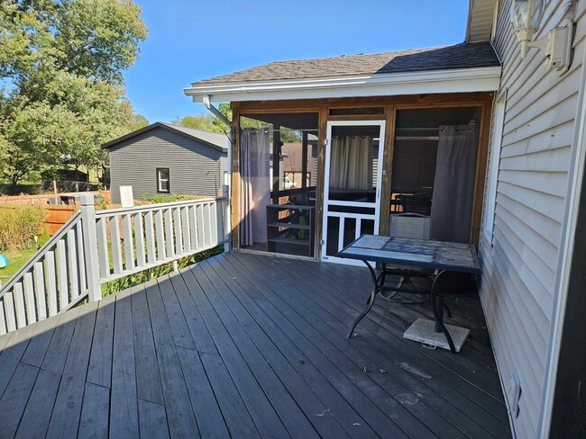 Deck and screened in porch with hot tub - 4047 Mogadore Rd