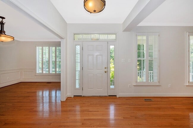 Photo - Main Level Primary Suite & Soaring Two Story Family Room