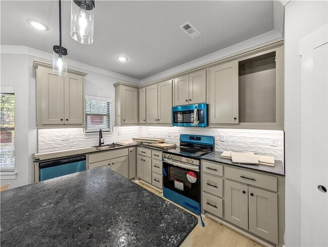 Photo - Modern open-concept living meets peaceful nature views in this custom-crafted retreat.