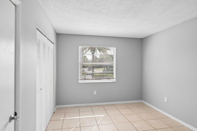 Explore the spacious interiors of Clear Lake Palms Apartments, featuring ample natural light and modern finishes. This bright room invites you to create your perfect retreat. Schedule a tour today to see your new home!