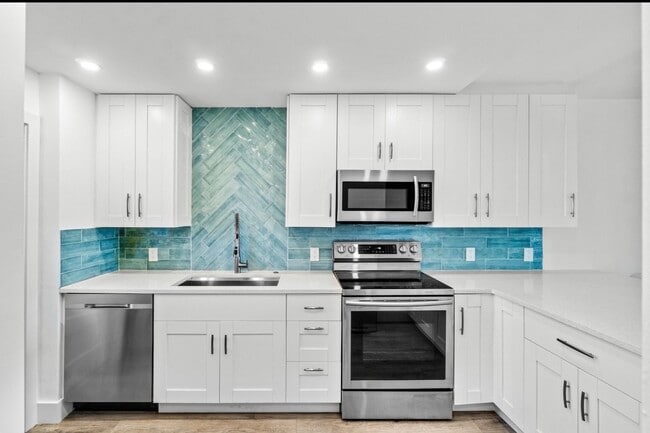 Building Photo - 698 NE Spanish River Blvd Unit 14