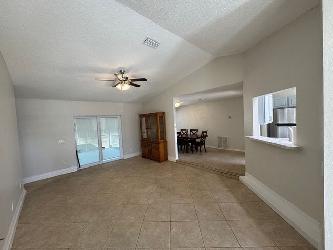 Photo - Spacious 3/2 Home with Screened Patio and Large Yard *Lawn Care Included!*