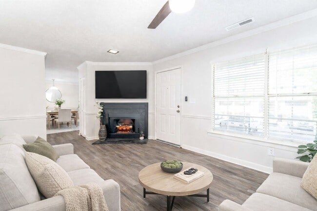 Enjoy comfortable apartment living at Sugar Creek Apartments in Winston-Salem, NC featuring bright living spaces, cozy fireplace, and stylish finishes designed for everyday comfort. - Sugar Creek Apartments