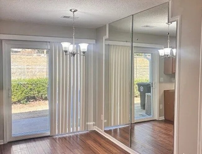 Backyard and sliding door - 108 Mangum Cir Townhome