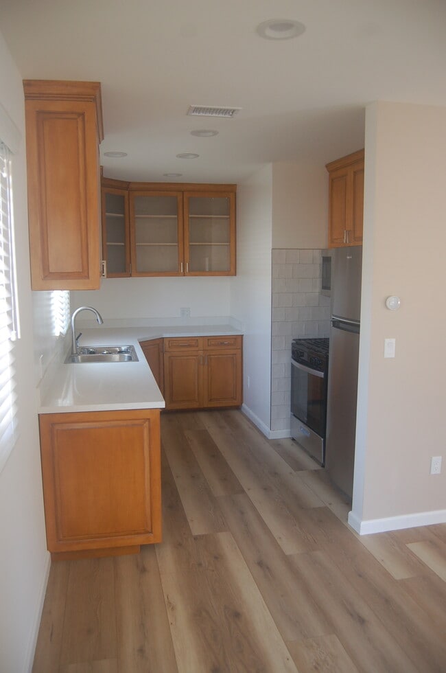 Kitchen with new stainless steel appliances, quartz counter top, lots of cabinet storage