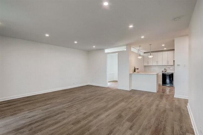 Living room with recessed lights, opens directly to kitchen! - 240 M St SW Unit E100