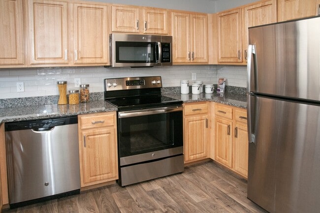 Granite countertops, backsplash, stainless steel appliances! - Chaska Place Apartments