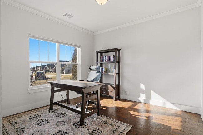 Photo - Stunner! This beautiful home features a spacious open floor plan with primary suite and private o...