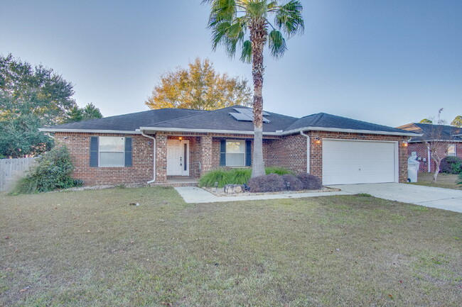 Building Photo - Energy-Efficient 3BR/2BA Solar Home in Pace with Screened Porch, Fenced Backyard, Updated Kitchen...