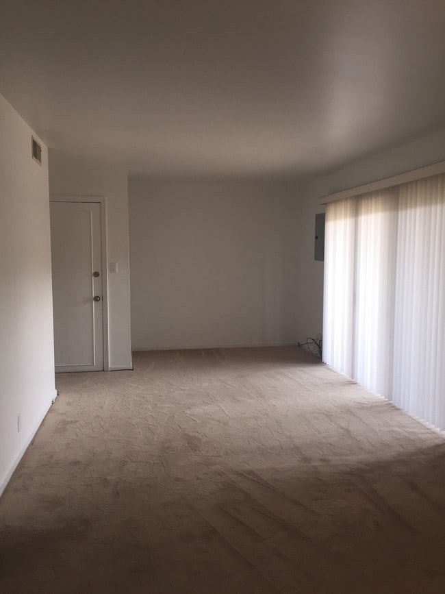 View from dining room into living room - 694 Robinwood Dr Unit B