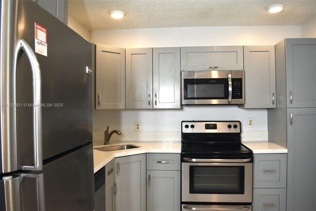 Building Photo - 4459 Carambola Cir S Unit 2605 Rental