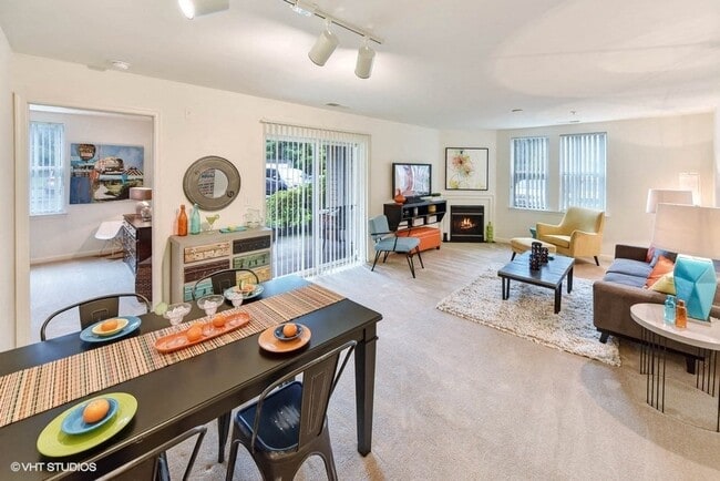 Open Floorplan with Defined Dining Area - The Residences at the Manor Apartments