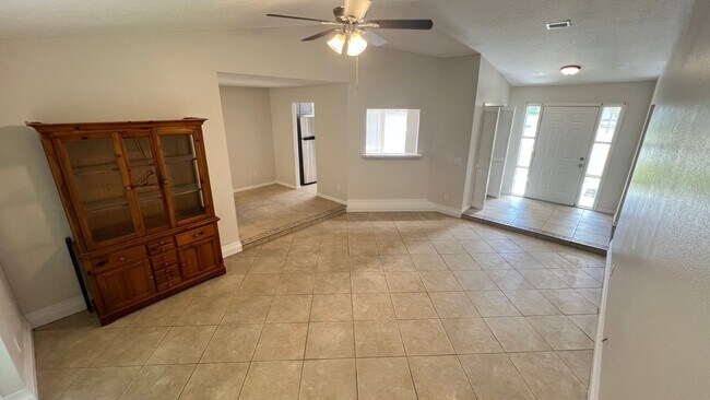 Photo - Bright & Spacious 3/2 Home with Huge Yard + Screened Patio — Lawn Care Included!