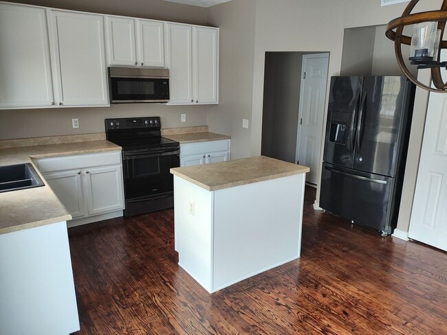 Photo - Beautifully maintained 4-bedroom, 2.5-bath over 2,200 sqft with a 2 car garage!