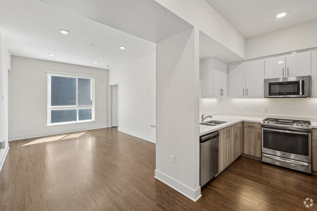 2 Bedroom A 2BR, 2BA - 816SF - Kitchen and Living Room