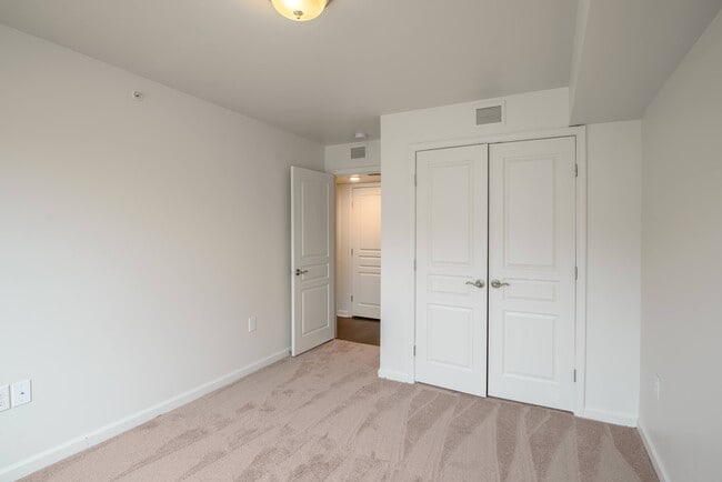 Spacious bedrooms with plush carpeting and large closets create a cozy and private retreat for relaxation.