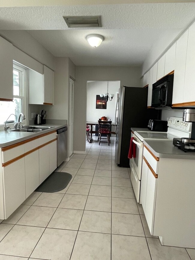 Photo - SOUTH GULF COVE-WATERFRONT POOL HOME!