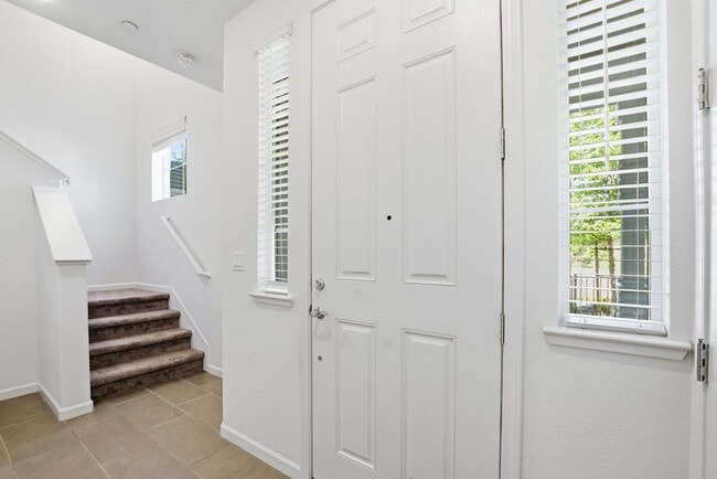 Photo - Spacious 3 Bed Townhome with Garage, A/C & Modern Finishes