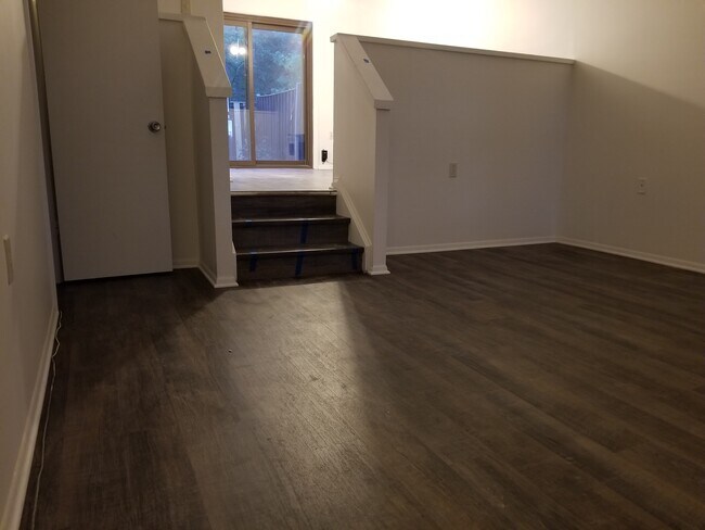 Large living room with stairs to dining room, kitchen & outside patio - 5405 Crossrail Dr