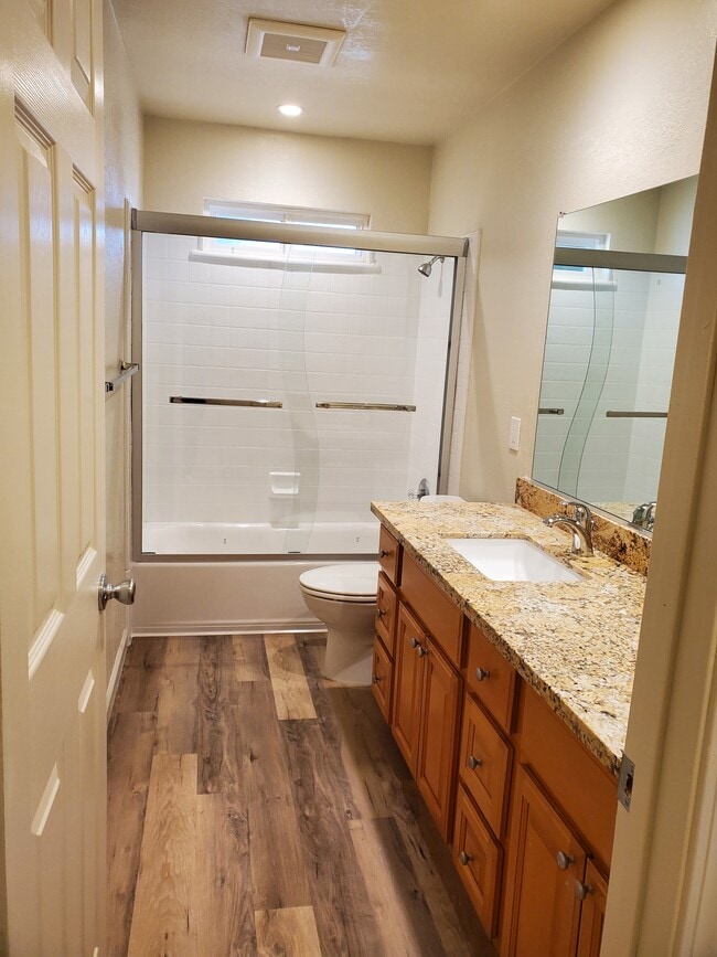 Plan B-1 bathroom w/ vinyl plank flooring