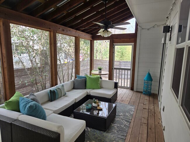 Screened porch connects garage to living room - 402 Irma Dr Townhome