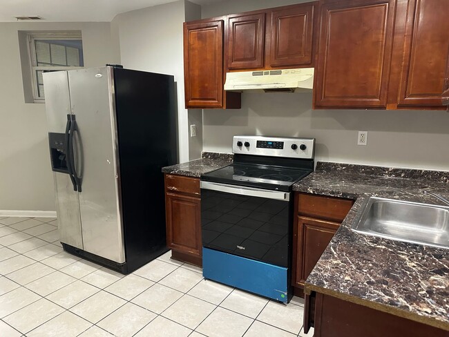 Photo - Spacious, Newly Renovated Home! Central Air! Finished Basement! W/D! Double Level Rear Deck! Avai...