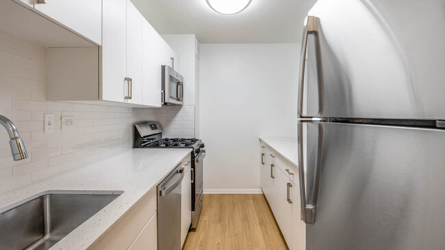 Kitchen with Stainless Steel Appliances - Emerson Place Apartments