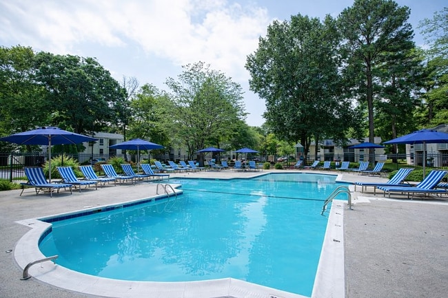 Sunny poolside retreat with lounge chairs