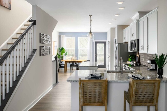 Expansive open-concept main level with 9-foot ceilings + luxury vinyl flooring - 1421 Lithium Ln Casa Adosada