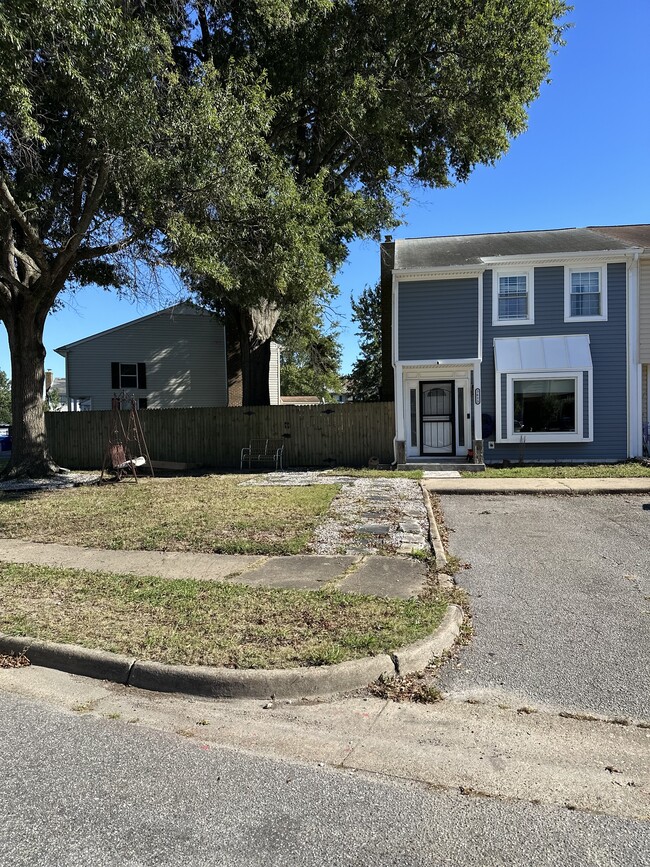 Corner townhouse, parking spaces, and side yard - 3613 Harbinger Rd Townhome