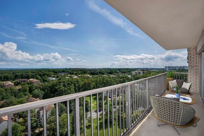 Large covered balcony at White Oak Towers Apartments in Silver Spring, MD