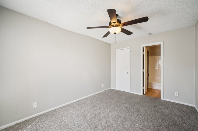 Welcome to The Riley Apartments, where modern comfort meets style. Enjoy spacious, well-lit interiors featuring plush carpeting and ceiling fans for a touch of elegance. Come see your new home today! Schedule your tour now.