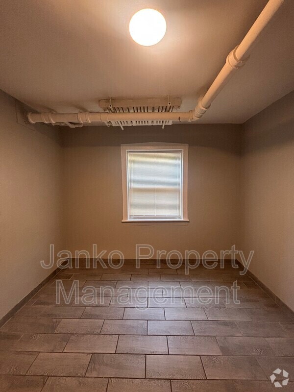 Building Photo - 6059 S Troy St Unit Garden Rental