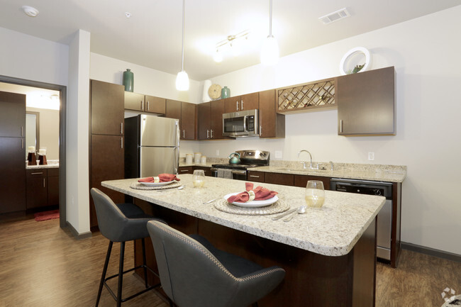 Stunning Kitchen with Stainless Steel Appliances and Granite - Springs At South Elgin Apartments