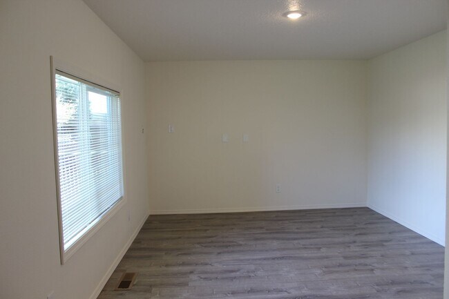 Photo - 4 BR, 2 1/2 BA home with fenced yard.