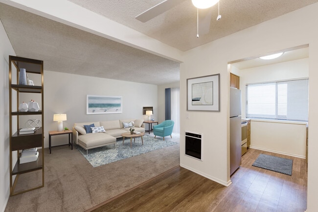 Renovated I kitchen and dining area with hard surface flooring and carpeted living area