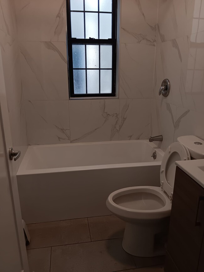Photo - 1046 E 228th St Townhome