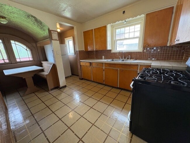 Photo - Spacious 4-Bedroom Akron Home with Charming Kitchen Nook & Backyard & Pet Friendly