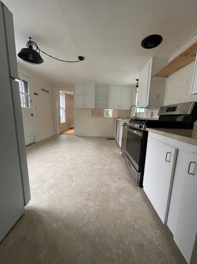 Kitchen with 2nd entrance from driveway - 13 Center St Unit #2