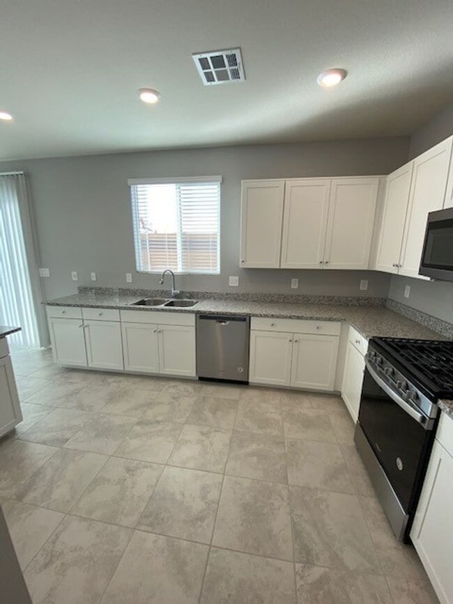 Photo - Modern North Las Vegas Townhome with Granite Countertops, Covered Patio & Open-Concept Living