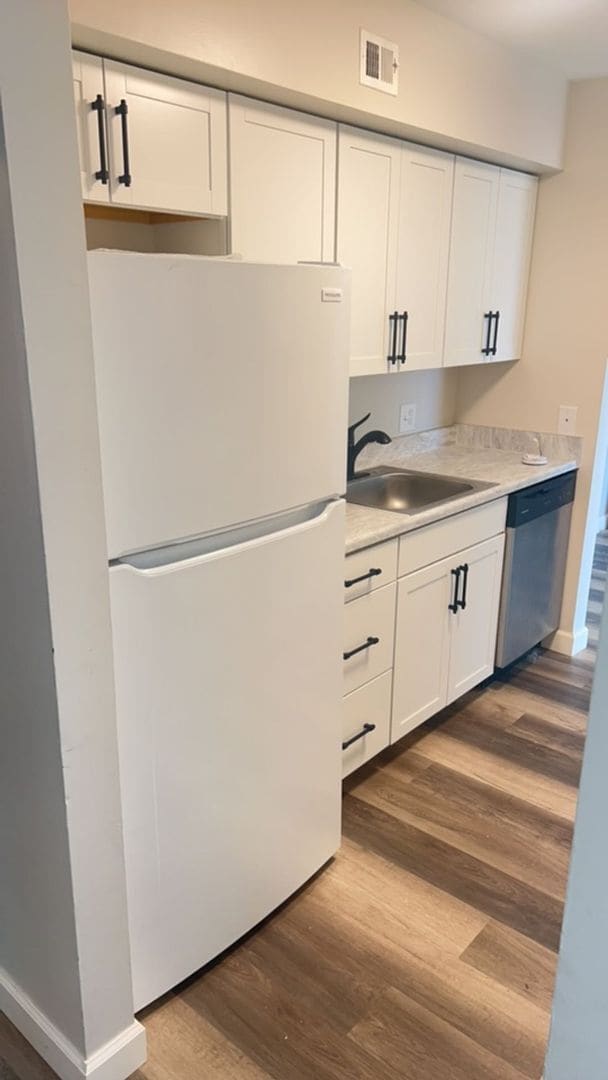 Photo - Fun and Stylish Living at Madison Manor! Top-Floor Condo with Vaulted Ceilings and Skylights