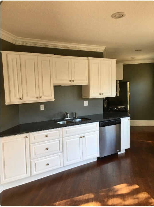 Updated kitchen with granite countertops and stainless steel appliances - 1233 46th St Townhome
