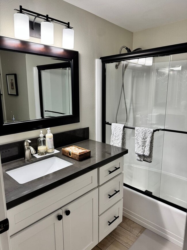 Photo - Charming 2-Bedroom, 1.5-Bath Apartment with Private Yard and 1 Car Garage Unit A