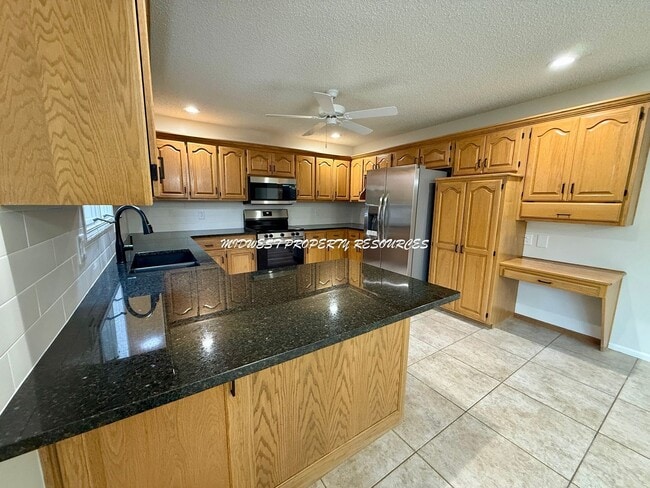 Photo - Spacious 3 Bedroom Home with Finished Basement, Covered Deck & Fenced Yard