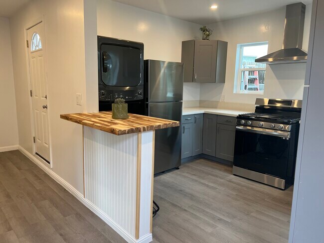 Table can be used as table for two or perfect for folding clothes. - 9300 Benson Way Unit B