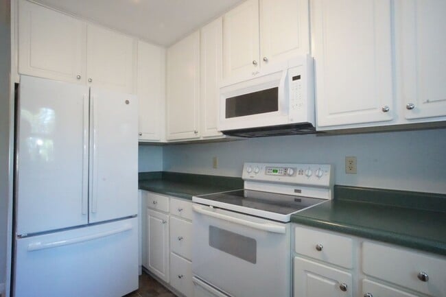 Photo - 4 Bed / 3 Bath.  Pet Friendly.  Reserved Parking. Master on Main.