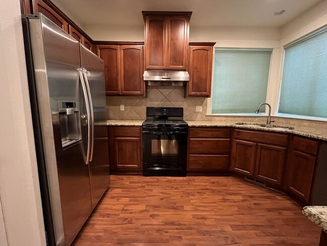 Photo - Stunning 2,588 Sq Ft Residence with Vaulted Primary Suite, Grand Staircase, and Granite Kitchen