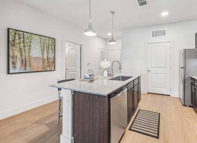 Your Kitchen: Granite countertops and pendant lighting