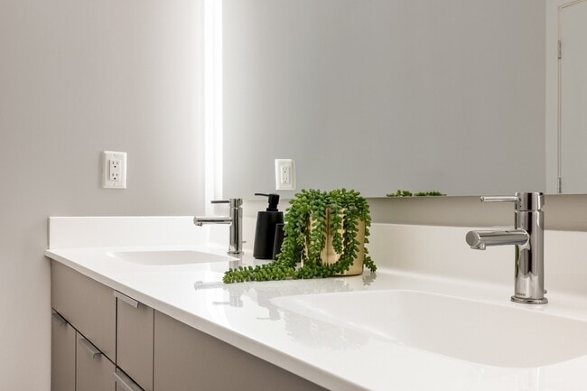 Indulge in tranquility with Modera Montville's serene bathrooms, boasting dual vanities and elegant marble countertops.