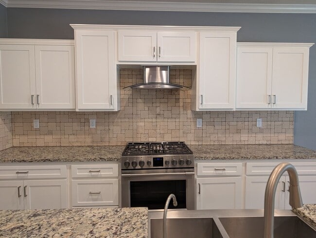 Photo - Modern 5 bedroom 3 bathroom home in the Riverstone Community offering solar, In-laws suite, den o...